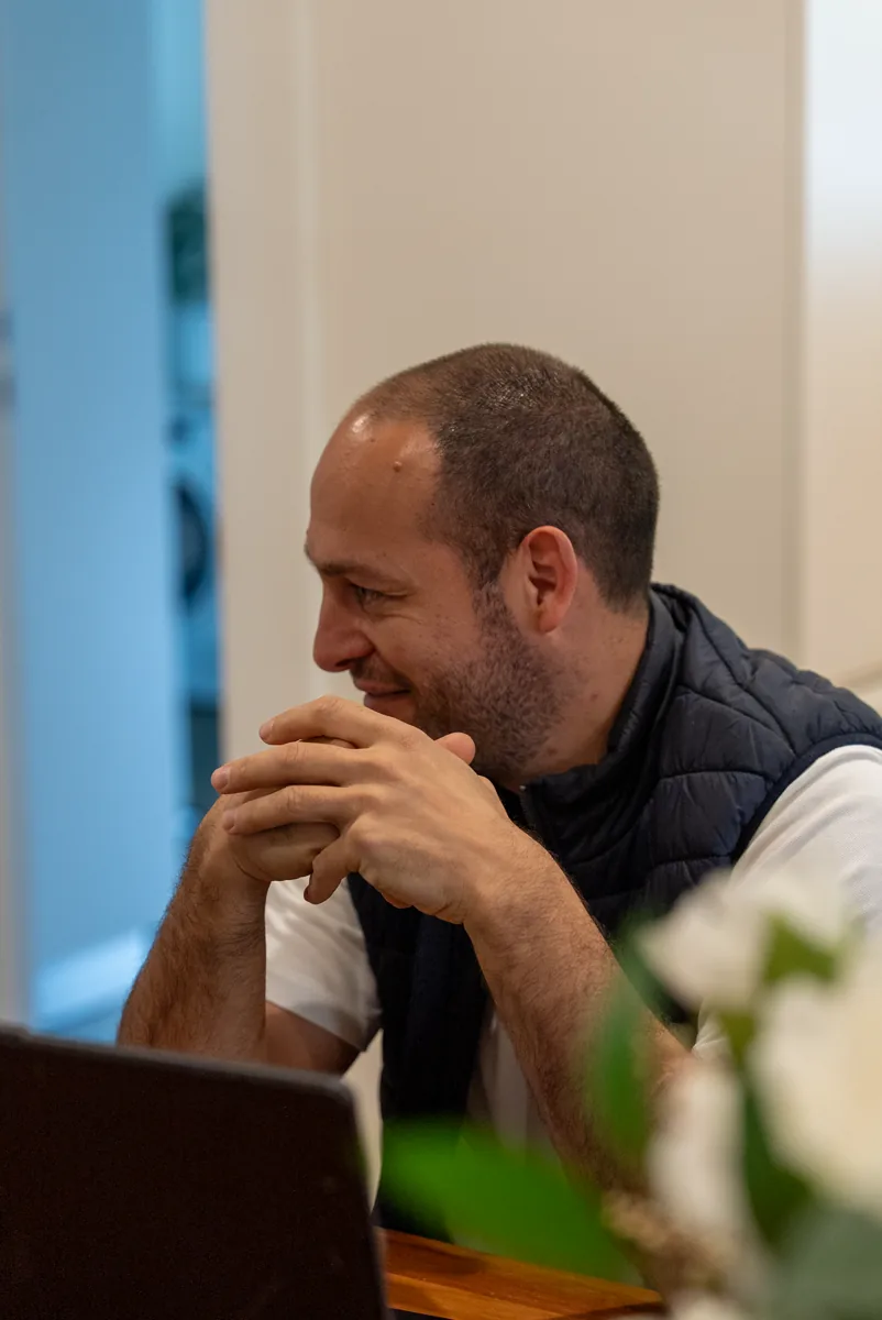 Dom, owner of Package Deal Bathrooms, walking a client through a bathroom design